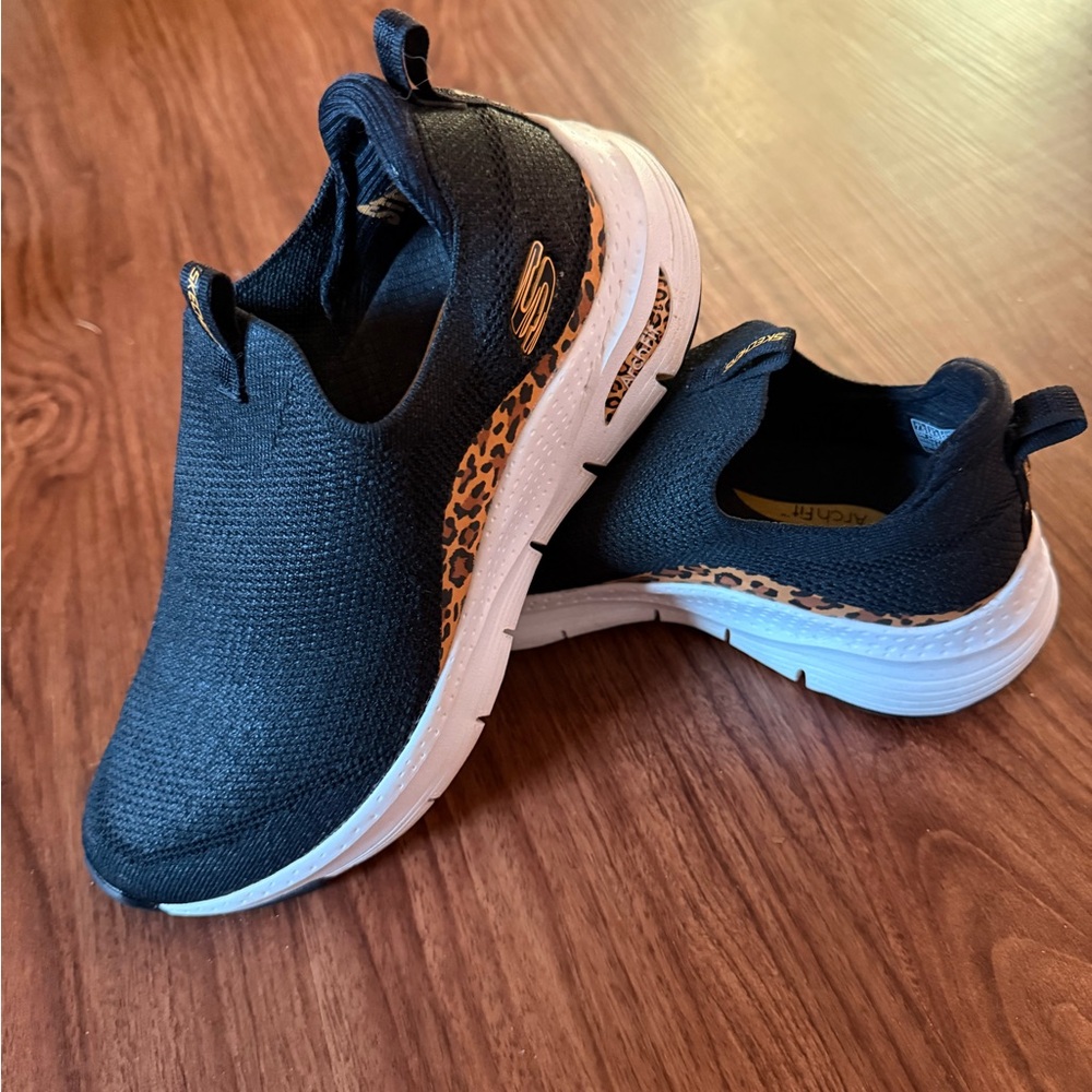 Skechers Women’s Black and Leopard Slip-On Sneakers